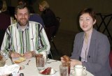 Mike Shadix (left) and Mia Sohn-White enjoy the food & entertainment provided at the 2001 banquet.